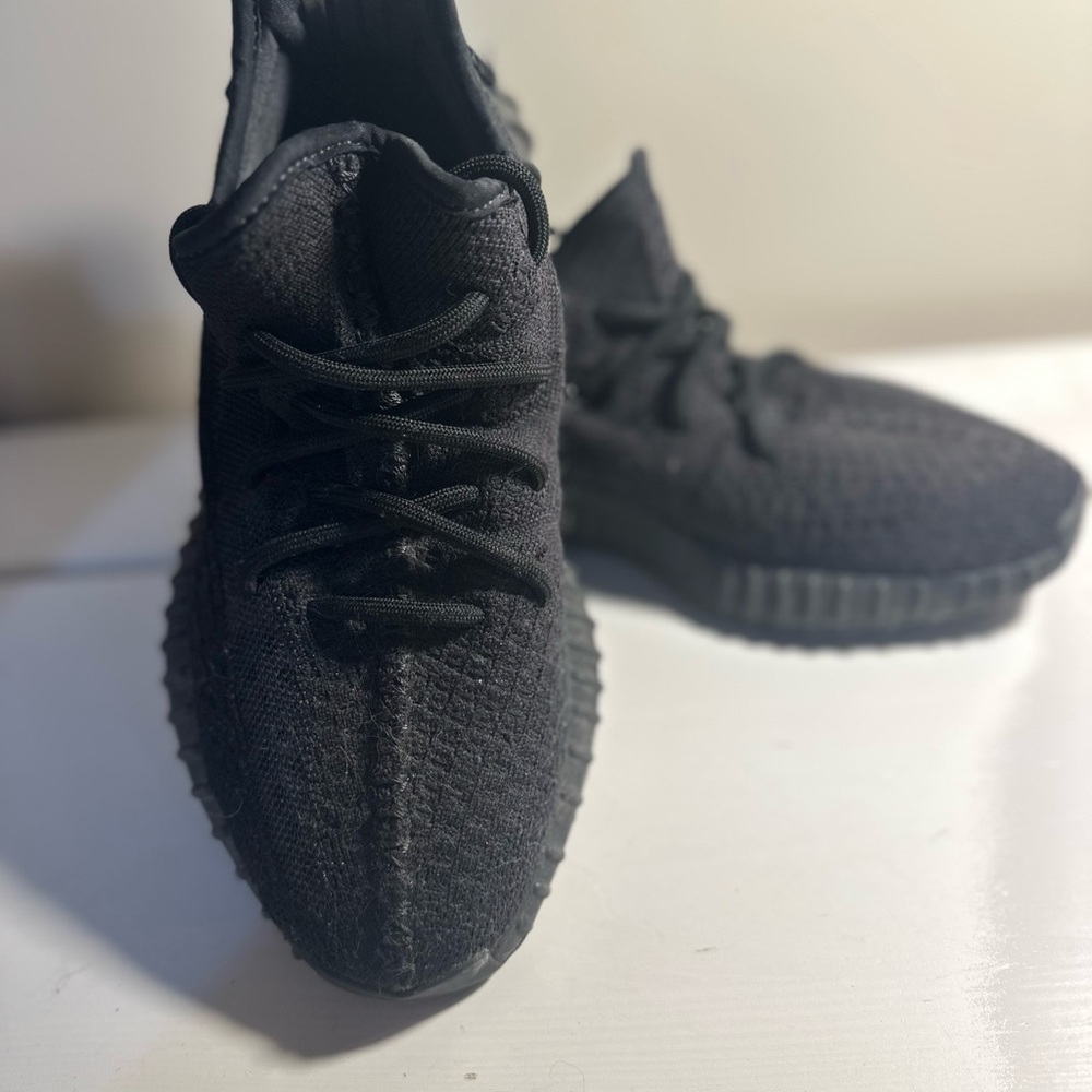 Yeezy adidas Black Sneakers fits woman size 8/8.5.